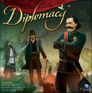 The game Diplomacy by Avalon Hill Hasbro features a dramatic cover illustration showcasing historical figures in military and formal attire. The background depicts a map with various geographical elements, symbolizing international intrigue and strategy. The title 'Diplomacy' is elegantly styled at the top, emphasizing the themes of trust and treachery inherent in the game.