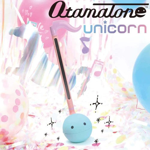 The Otamatone Unicorn by Hamee is a whimsical musical instrument shaped like a blue unicorn with a pink horn and a smiley face. It is surrounded by colorful confetti and balloons, creating a festive atmosphere. The unicorn-shaped musical toy features a simple design and is ideal for kids and adults alike, promoting creativity and fun.