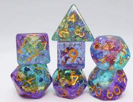 A vibrant Reminisce RPG Dice Set by Foam Brain, featuring various polyhedral dice in shades of purple, blue, and green with golden numbers. The set includes a transparent tetrahedron, dodecahedron, and other shapes, stacked artistically to showcase their unique designs and colors, ideal for tabletop gaming enthusiasts.