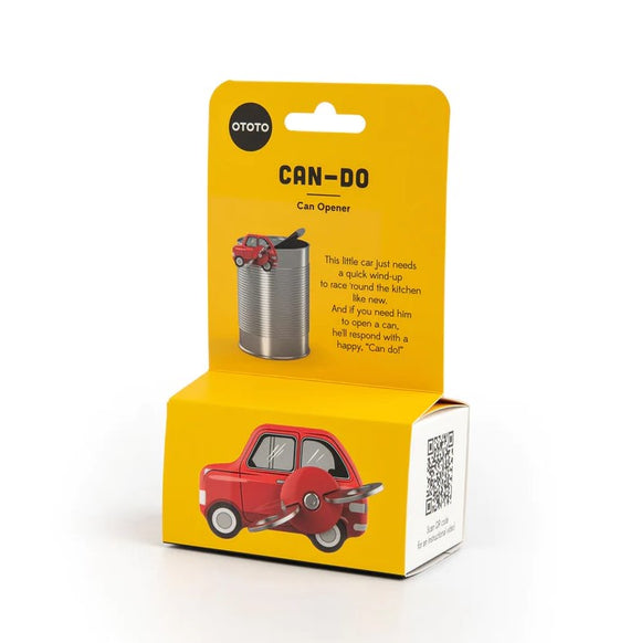 The Can-Do Can Opener by OTOTO is packaged in a vibrant box featuring a cheerful red car design. The front shows a cartoonish car next to a can, highlighting its functionality. Instructions on the back explain that the car needs to be wound up to assist in opening cans, promoting a fun and playful kitchen experience.