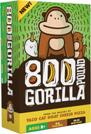 The box of '800 Pound Gorilla' by Dolphin Hat Games featuring a playful cartoon gorilla surrounded by whimsical characters like a narwhal and a beaver. The packaging is bright and colorful, showcasing the game's fun aesthetic. Suitable for 2-6 players aged 8 and up, with a gameplay duration of 10-15 minutes.