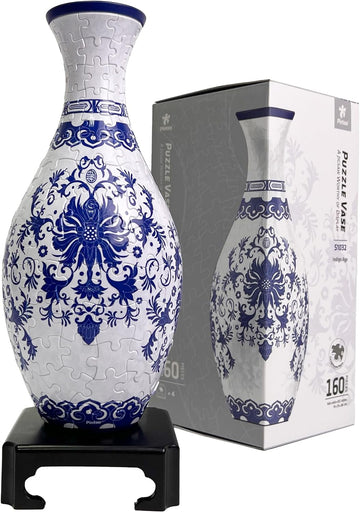 Pintoo P- Vase S1032 Indigo Age jigsaw puzzle featuring a beautifully designed vase with intricate blue and white floral patterns, displayed on a black stand. The puzzle comes in a box, showcasing its 160 pieces and recommended for ages 4 and up.