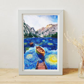 A vibrant jigsaw puzzle featuring a serene boat scene in a starry night sky, inspired by famous artwork. Two wooden boats float on swirling blue waters, surrounded by picturesque mountains and a bright sky. The puzzle is framed and set against a simple, light background, showcasing the vivid colors and intricate details of the design.