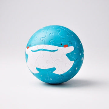 Round jigsaw puzzle of a whale shark designed by Pintoo. The puzzle features a vibrant blue color with a friendly whale shark illustration, perfect for puzzle enthusiasts and marine life lovers. It's a unique spherical puzzle that offers a fun and engaging challenge.