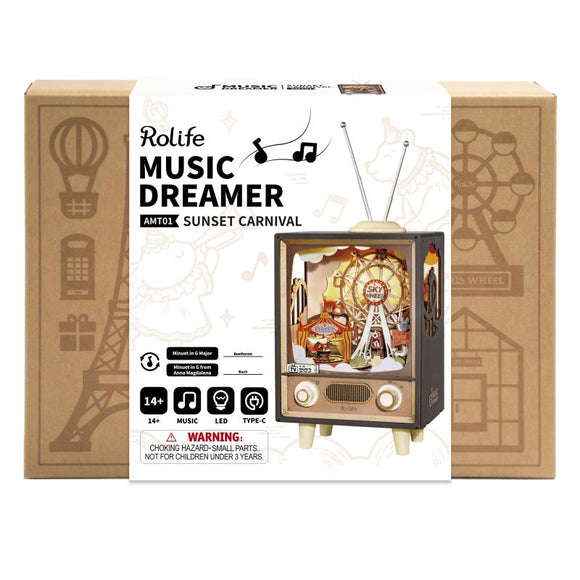 The Music Dreamer Sunset Carnival DIY kit by Robotime showcases a whimsical carnival scene with a ferris wheel and musical elements inside a retro-style television. The packaging features engaging graphics and a warning that the kit includes small parts, suitable for ages 14 and up.