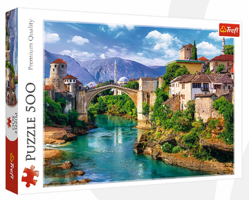 A beautiful jigsaw puzzle featuring the iconic Old Bridge in Mostar, Bosnia. The image showcases the picturesque bridge arching over a vibrant blue river, with charming buildings nestled along rocky banks and a backdrop of stunning mountains under a clear sky. This 500-piece puzzle by Trefl promises a delightful and challenging experience for puzzle enthusiasts.