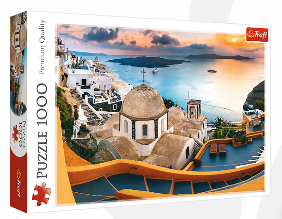 Fairytale Santorini jigsaw puzzle by Trefl, featuring a beautiful scene of white buildings with blue domes overlooking the sea at sunset. The puzzle consists of 1000 pieces, showcasing stunning colors and intricate details, perfect for puzzle enthusiasts and lovers of travel-inspired art.