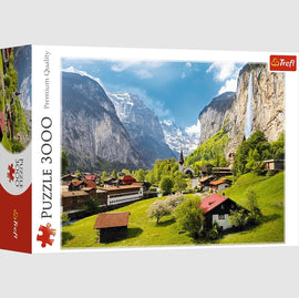 Trefl jigsaw puzzle featuring a scenic view of Lauterbrunnen, Switzerland, showcasing stunning mountains, lush greenery, and charming houses. The puzzle contains 3000 high-quality pieces perfect for hours of engaging fun.
