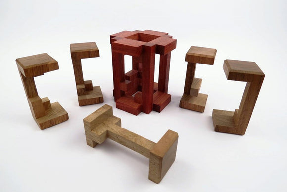 A mechanical puzzle titled 'Tower' by Pelikan Puzzles. The image shows the intricate wooden structure of the puzzle, including several geometric pieces arranged around a central tower. The puzzle features a variety of unique shapes, highlighting its complexity and craftsmanship.