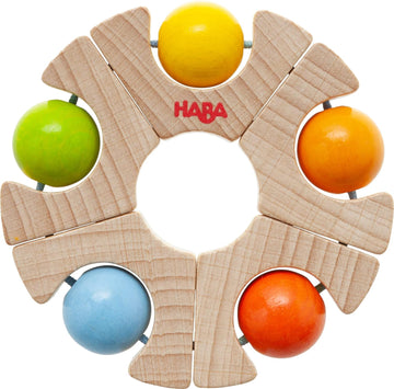 Grasping Toy Ball Wheel by Haba, featuring a circular wooden design with five colorful balls (yellow, green, blue, orange) arranged in an interactive format. Ideal for developing fine motor skills in children.