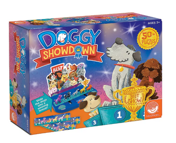 The 'Doggy Showdown' game by MindWare features a colorful box with illustrations of various dogs ready for a competition. The box highlights the gameplay, showing how players can slide dogs into a winning lineup, with a trophy labeled 'Best in Show.' Suitable for ages 3 and up, it promises fun with over 50 puzzles included.