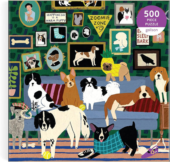 Vibrant jigsaw puzzle illustration featuring a playful gathering of various dog breeds in a cozy living room setting. Dogs are engaged in various activities, surrounded by quirky framed pictures on the walls, showcasing a fun and colorful theme perfect for dog lovers. The puzzle consists of 500 pieces, ideal for family game nights or solo relaxation.