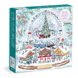 Michael Storrings Alpine Village Snowglobe jigsaw puzzle featuring a festive winter scene with a snow globe displaying a Christmas tree, a quaint village, and snow-covered houses. The puzzle includes 500 foil pieces for a delightful holiday activity.