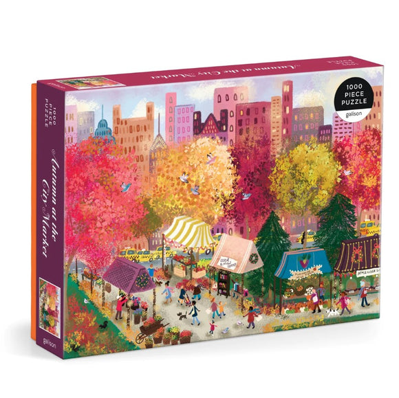 The jigsaw puzzle titled 'Autumn at the City Market' by Galison features a vibrant autumn scene in a city market, depicting colorful trees, festive stalls, and bustling people enjoying the fall ambiance. The puzzle includes 1000 pieces and showcases detailed artwork that captures the essence of a lively market during autumn.