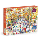 Michael Storrings Fall in Central Park jigsaw puzzle by Galison featuring a vibrant autumn scene in Central Park, with colorful trees, people walking, and activities in the park. The box displays a lively illustration capturing the essence of fall.