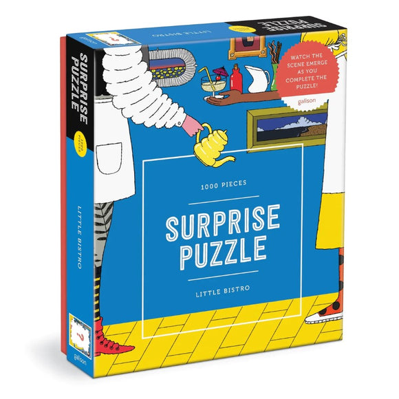 Packaging of the Little Bistro Surprise Puzzle by Galison. The jigsaw puzzle features a vibrant illustration with a whimsical bistro scene, showcasing 1000 pieces. The box highlights the colorful design and includes a note encouraging users to watch the scene emerge as they piece together the puzzle.