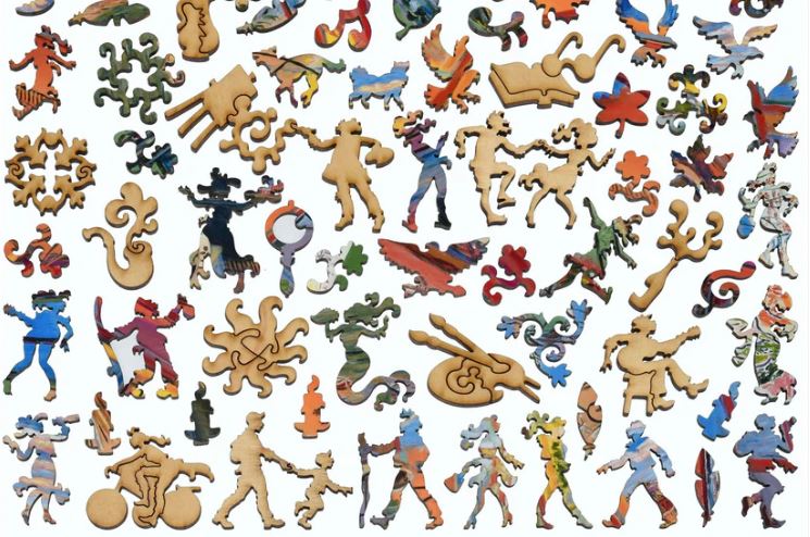 A vibrant assortment of intricate jigsaw puzzle pieces from the Matisse's Studio puzzle by Liberty Puzzles. The pieces showcase colorful designs and playful shapes, including human figures, abstract forms, and intricate patterns, creating a dynamic collage that highlights the artistic style reminiscent of Matisse.