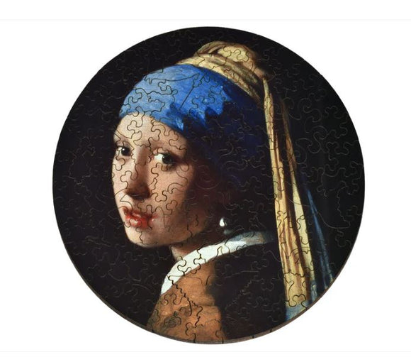 A round jigsaw puzzle featuring the famous painting 'Girl with a Pearl Earring' by Johannes Vermeer. The image showcases the young girl with a blue and yellow headscarf, turned slightly to her left, her captivating gaze directed toward the viewer. The puzzle pieces are intricately shaped, providing a unique challenge for puzzle enthusiasts.