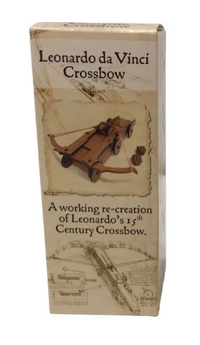The packaging for the Mini Crossbow from Pathfinders features a detailed illustration of a 15th-century Leonardo da Vinci crossbow model. The box showcases the product's name and describes it as a working re-creation of Leonardo's design. The overall aesthetic combines historical references with a clean, educational layout, making it appealing for DIY enthusiasts and history buffs.