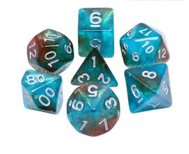 A set of RPG dice featuring a vibrant blue nebula design with a glow-in-the-dark feature. The set includes multiple shapes like a d20, d12, d10, d8, d6, and d4, each showcasing swirling colors of blue, green, and hints of brown.
