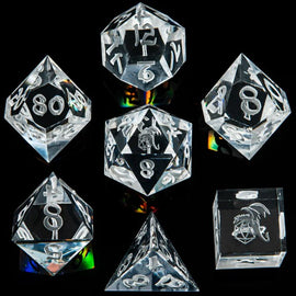 A set of eight white crystal sharp edge dice by Hymgho, including various shapes such as d4, d6, d8, d10, d12, and d20. Each die features clear, engraved numbers and symbols for easy reading, displayed on a dark reflective surface.