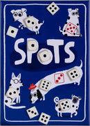 The game 'Spots' features playful illustrations of dogs with various accessories and dice scattered across a blue background. The title 'SPOTS' is prominently displayed, surrounded by charming dog characters, each with unique expressions and styles. The dice add a fun element to the design, emphasizing the game's interactive nature.