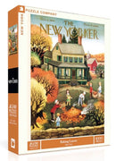 The packaging of the 'Raking Leaves' jigsaw puzzle by New York Puzzle Company features an illustrated scene reminiscent of a fall day. It shows children and adults raking leaves in front of a charming house. The artwork, originally from The New Yorker magazine, conveys a nostalgic autumn ambiance with vibrant colors. The puzzle contains 1000 pieces and is suitable for ages 8 and up.