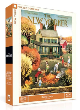 The packaging of the 'Raking Leaves' jigsaw puzzle by New York Puzzle Company features an illustrated scene reminiscent of a fall day. It shows children and adults raking leaves in front of a charming house. The artwork, originally from The New Yorker magazine, conveys a nostalgic autumn ambiance with vibrant colors. The puzzle contains 1000 pieces and is suitable for ages 8 and up.