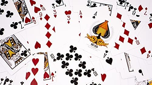 An assortment of colorful playing cards fanned out, featuring the Bicycle Honeybee design by US Playing Card Co. The unique card faces include intricate illustrations with a honeybee motif on the Ace.