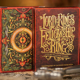 The Fellowship of the Ring luxury playing cards by Kings Wild, featuring intricate artwork including the Eye of Sauron, surrounded by elaborate designs and the title in gold lettering. Ideal for fans of The Lord of the Rings.