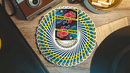 A beautifully fanned out deck of CSI Playing Cards featuring a bold crime scene design on the top card. The vibrant yellow and blue colors contrast nicely with the wooden background and vintage camera nearby, creating an engaging game-themed scene.