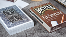 A set of Bicycle Sketch Playing Cards featuring a limited edition design. The deck includes 54 cards and is presented in a brown sketchbook-style box. The back of the cards displays a detailed, intricate blue design, while the box is marked with the word 'Bicycle' and 'SKETCH' in prominent lettering.