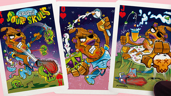 Frost'd Playing Cards by Howlin' Jack's featuring whimsical illustrations of a cartoon lion character involved in humorous and adventurous scenes. The vibrant cards showcase the Jack, Queen, and a unique character design, perfect for game nights. The playful art emphasizes a mix of fun and fantasy, making these cards a great addition to any games collection.
