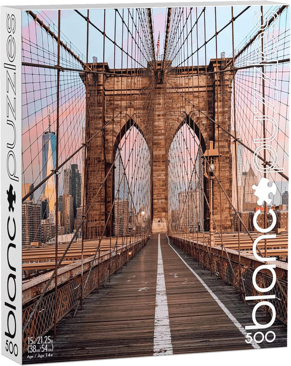 Blanc Puzzles Brooklyn Bridge jigsaw puzzle featuring a beautifully captured image of the iconic Brooklyn Bridge in New York. The puzzle contains 500 pieces and measures 15 x 21.25 inches when completed. Perfect for puzzle enthusiasts and lovers of NYC.