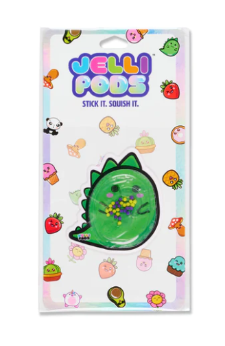 A Jelli Pods product featuring a green, squishy, dinosaur-shaped toy surrounded by colorful, playful illustrations of various food items, fruits, and sweet treats. The packaging is adorned with cute designs, inviting play and tactile interaction.