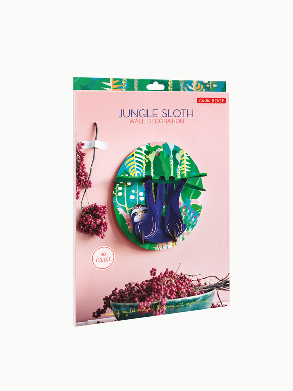The Jungle Sloth by Studio Roof is a colorful wall decoration featuring two playful sloths against a vibrant jungle background. The product showcases intricate designs printed on recycled cardboard. It's perfect for adding a touch of nature-inspired decor to your home or office. The packaging emphasizes its eco-friendly materials and 3D design, making it an eye-catching addition to any space.