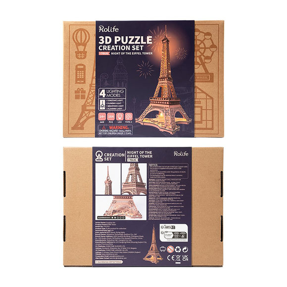 Eiffel Tower Large DIY kit by Robotime, featuring a 3D puzzle creation set with the option to light up in four different modes. The packaging showcases the Eiffel Tower model, suitable for ages 14 and up. It includes assembly instructions and highlights its intricate design and details, perfect for enthusiasts and those looking for a fun crafting experience.