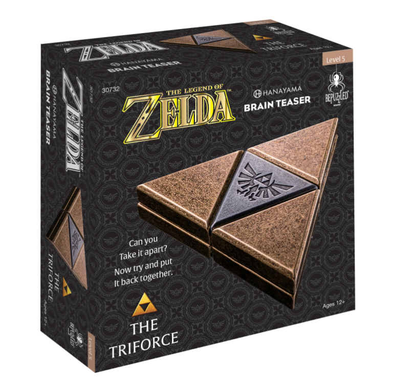 Zelda TriForce cast mechanical puzzle by Hanayama. The packaging features the iconic Triforce symbol in a stylish bronze finish, with the Zelda logo prominently displayed. The box showcases the challenge of taking the puzzle apart and putting it back together, appealing to fans of brain teasers.