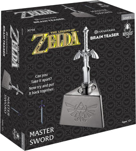 The Legend of Zelda Master Sword mechanical puzzle by Hanayama, featuring a metallic sword design mounted on a pedestal. The box displays the title and a challenge: 'Can you take it apart? Now try and put it back together.' Perfect for ages 12 and up.
