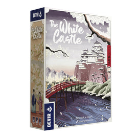 The White Castle board game by Devir features a beautifully illustrated box showcasing a scenic view of a castle surrounded by a river and cherry blossom trees. The packaging includes artistic elements and cultural motifs, making it visually striking.