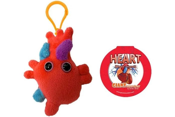A plush Heart Organ Keychain by Giantmicrobes, featuring a red heart-shaped design with colorful details resembling heart anatomy. It has large, adorable eyes and a yellow clip for easy attachment to bags or keys. A circular tag showcases the product name and brand.