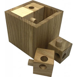 The Akadia XS is a beautifully crafted mechanical puzzle made of natural wood. It features a cube design with removable pieces shaped like small cubes and rounded pegs. The puzzle challenges users to figure out how to disassemble and then reassemble it. The warm, natural tones of the wood make it an elegant addition to any collection.