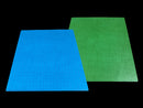 A reversible battle mat featuring a vibrant blue side and a bright green side, both with a grid pattern for gaming. Ideal for tabletop games, the mat is durable and portable, allowing players to switch between colors for different game scenarios.