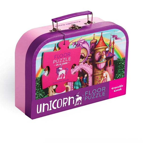 Crocodile Creek Unicorn Floor Puzzle in a portable case, featuring colorful illustrations of unicorns, castles, and fairytale characters. The puzzle comes with a vibrant pink handle for easy transport, making it perfect for kids to enjoy at home or on the go.