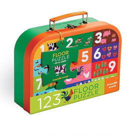 Barnyard 123 Floor Puzzle by Crocodile Creek, featuring vibrant illustrations of farm animals and numbers from 1 to 9. The puzzle comes in a sturdy case with a handle, making it perfect for storage and travel. Ideal for children to develop their counting and problem-solving skills while having fun.