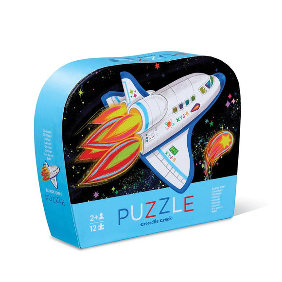 Blast Off Mini Puzzles by Crocodile Creek features a colorful jigsaw puzzle box with a vibrant spaceship graphic and space-themed designs. The packaging includes age recommendations and puzzle piece counts, ideal for young space enthusiasts. Perfect for developing problem-solving skills and hand-eye coordination.