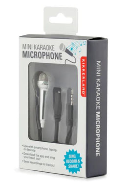 The Mini Karaoke Microphone by Kikkerland, packaged in a stylish box, showcases a compact silver microphone with a mesh head and a connecting cable. The packaging highlights its features: compatibility with smartphones, laptops, or desktops, and the ability to download an app for singing and recording. The design is user-friendly and perfect for karaoke enthusiasts looking to share their performances.