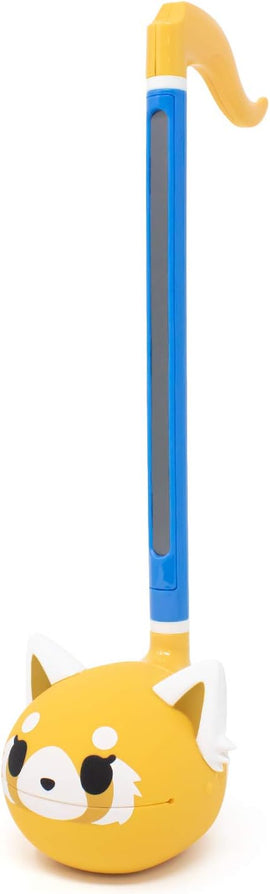 The Otamatone Sanrio - Aggretsuko is a vibrant yellow musical instrument shaped like Aggretsuko, featuring expressive eyes and cute ears. It has a long blue handle that allows for easy play, making it a perfect toy for music lovers and fans of the character.