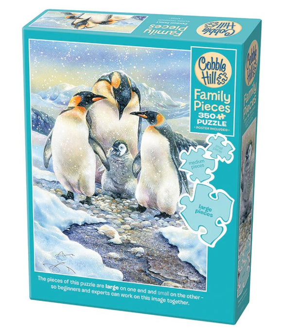 Cobble Hill Penguin Family Jigsaw Puzzle featuring a beautiful illustration of four penguins and a chick in a snowy landscape. The puzzle has 350+ pieces and includes a poster. The pieces are designed for varying skill levels with large and medium options.