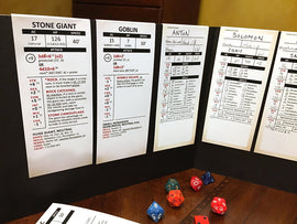 A display of character and monster stat trackers for Dungeons & Dragons 5th Edition. Includes detailed sheets for a Stone Giant and Goblin, showing attributes like AC, HP, speed, and various abilities along with dice used in gameplay.